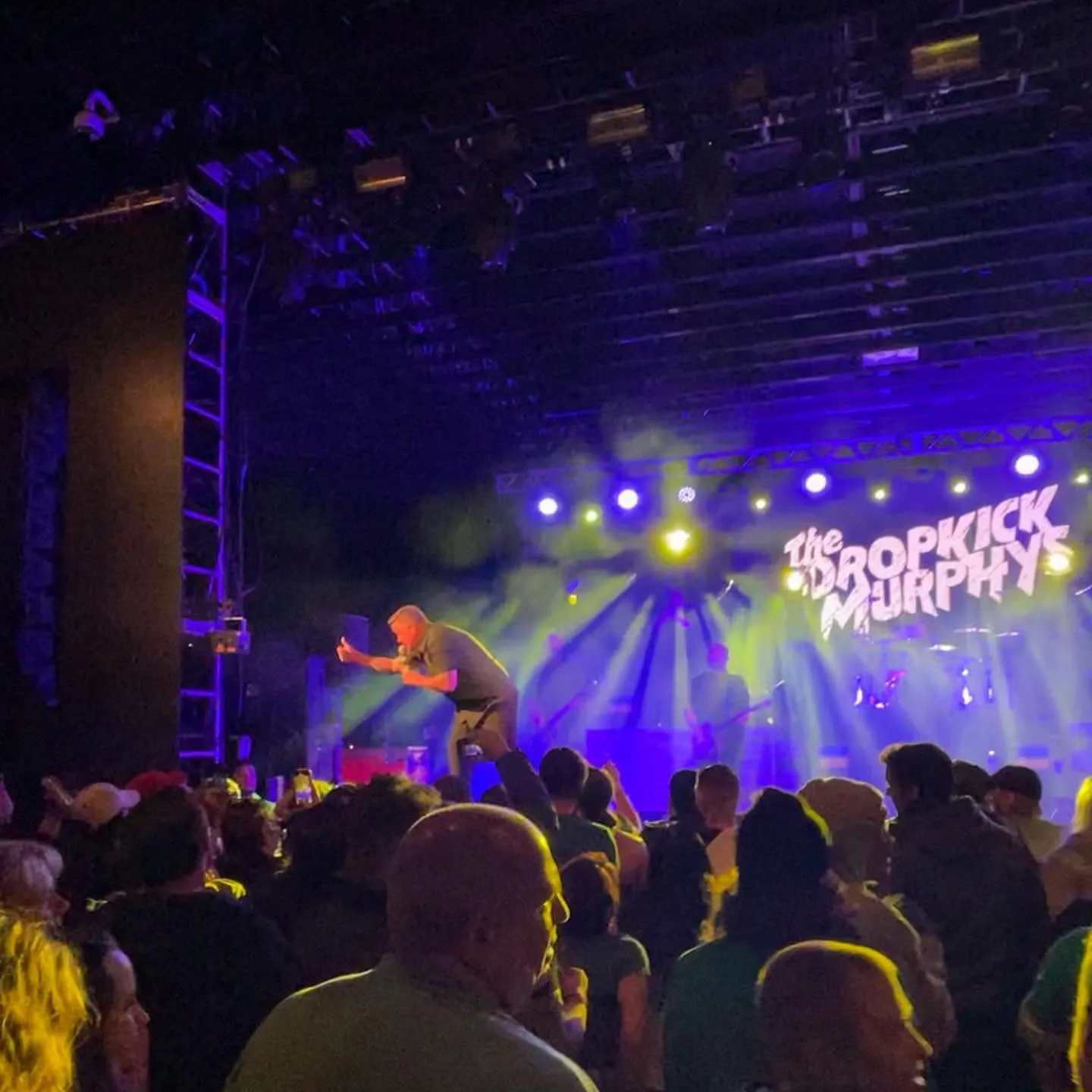 The Dropkick Murphys play to a packed crowd at ShamrockFest, the band’s name lit on the screen behind them
